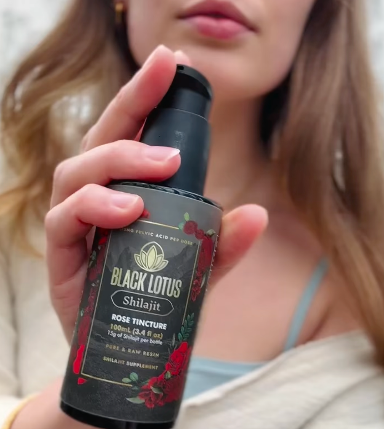 Woman holding Black Lotus Shilajit