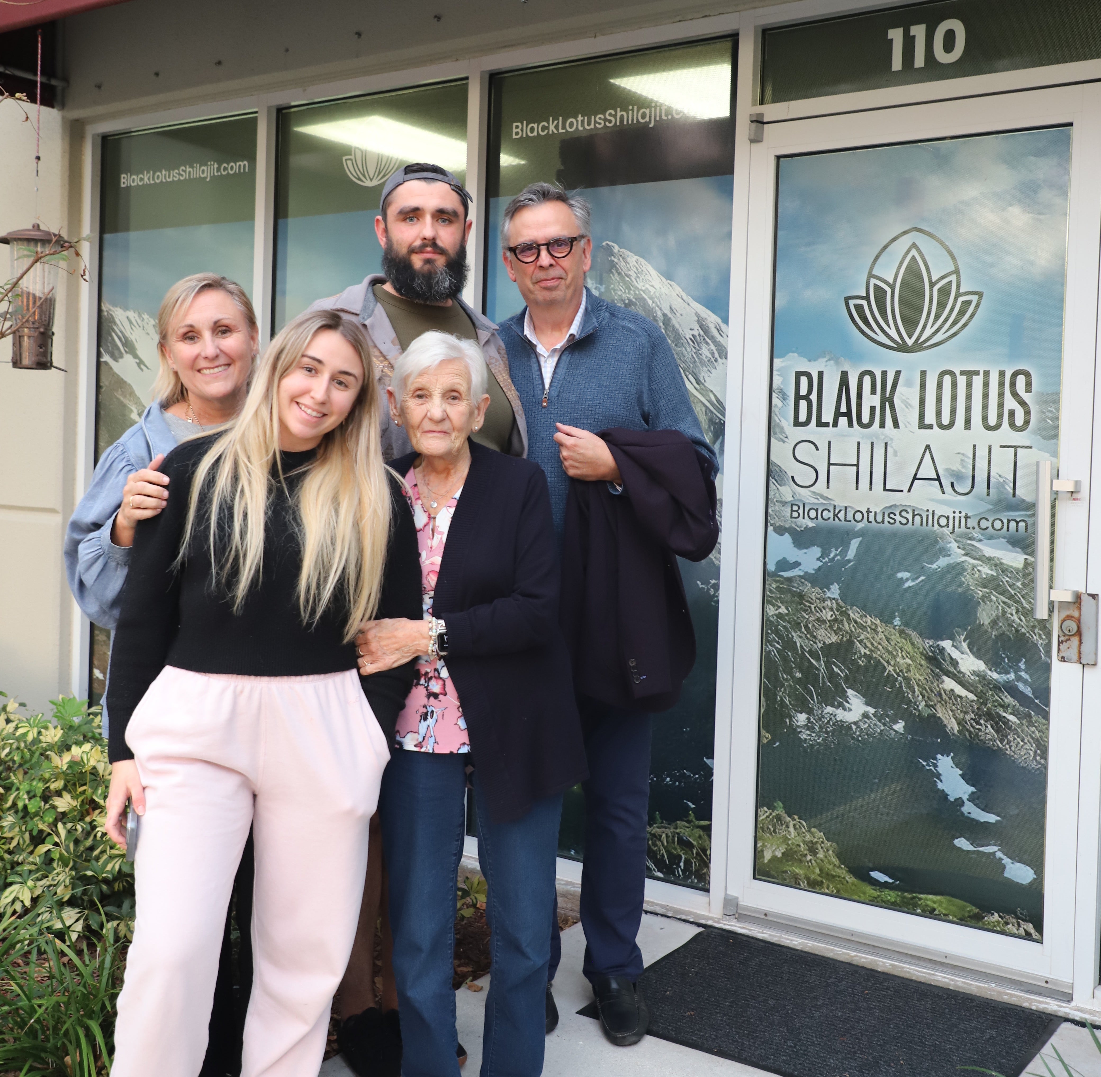The Black Lotus Shilajit family in front of their storefront